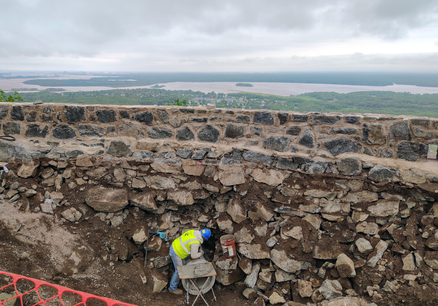 John Talarico works on the Bardon Peak Overlook retaining wall, June 26, 2025. Credit: John Ramos