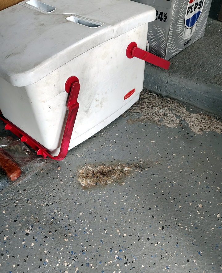 2025-07-20, Scorch mark on Judy Johnson's garage floor