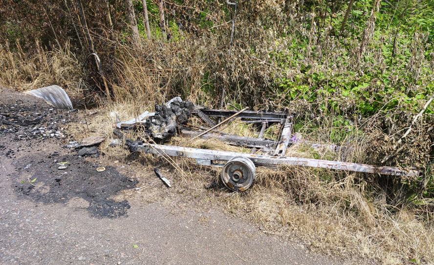 Wolf's torched trailer, July 20, 2025. Credit: John Ramos