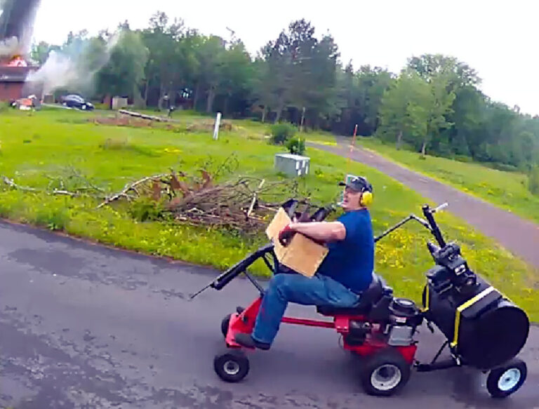 Adam Wolf approaches Judy Johnson's house on the arson mower, July 15, 2025. Video still courtesy of Judy Johnson.