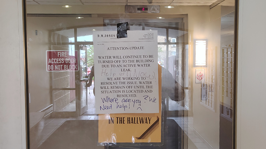 2026-07-26, Sign posted by of Village Place Apartment Building. Credit: John Ramos