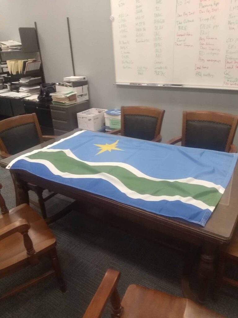 Flag-raising scheduled for Sept. 18. Or maybe not.