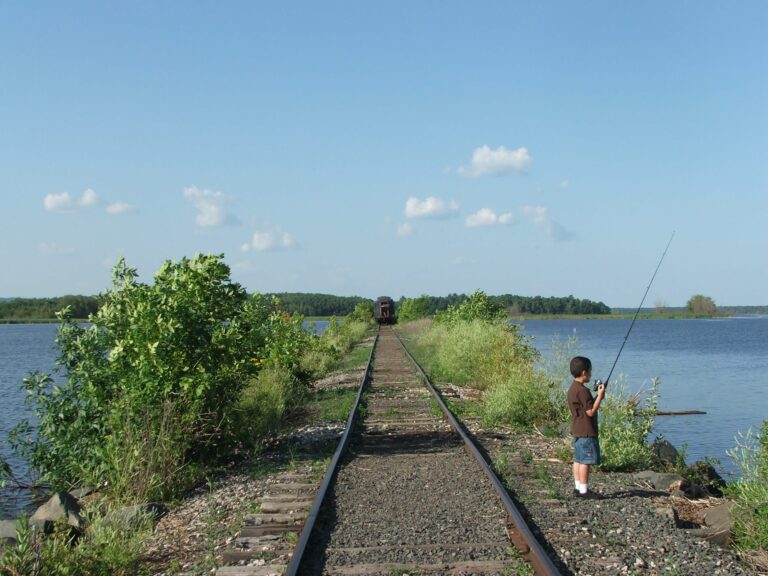 Train and boy on causeway, 2017. Credit: John Ramos